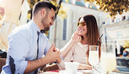 Romantic couple at the meeting in a cafe. Dating, love, relationships