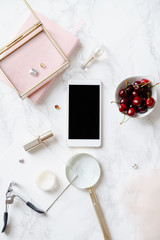 Flatlay mock up with mobile phone screen and feminine accessories on marble background