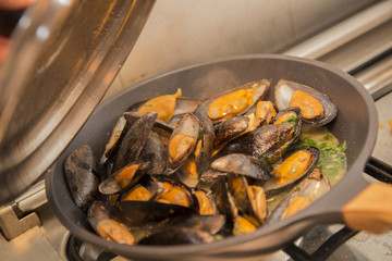 close-up of mussels cooking in a pan 2