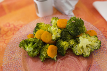 close-up of steamed vegetables in the plate on the table