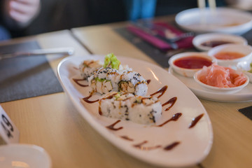 closeup of chinese food stuffed sushi with vegetables and meat