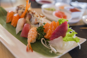 closeup of chinese food with sushi prepared and decorated in different ways