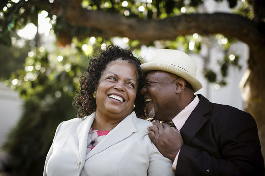 Close-up of happy senior couple standing at park