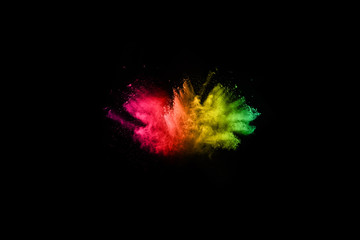 Multicolor powder explosion on black background. 