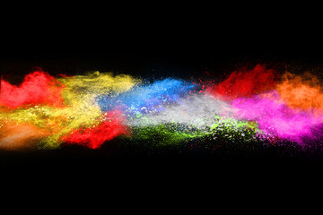 Multicolor powder explosion on black background. 