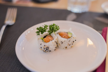 closeup of plate with chinese single dose sushi food