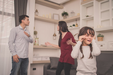 The concept of parental family quarrels, Young Couple Parents are fighting in front of children....