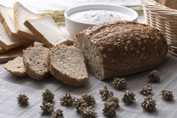 Deliciously decorated breads with ornamental items such as wheat flour and rice kernels.