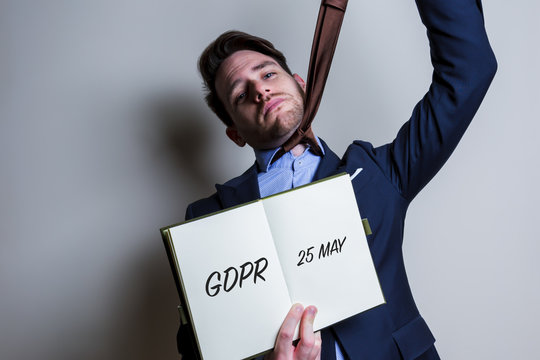 Nervous business man handle note with GDPR (General Data Protection Regulation) act title