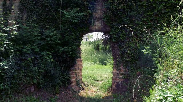 stone wall with arch to bring out the injured horses in Roman times at the Circus of Maxentius, ancient Appia