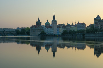 Fototapeta na wymiar view of Prague by the river, dawn on the Charles bridge next to the castle