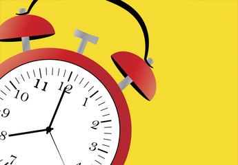 red alarm clock on a yellow background 