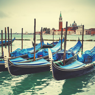 Venetian lagoon with moored gondolas