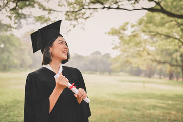 Graduation Concept. Graduated students on graduation day. Asian students are smiling happily on the...
