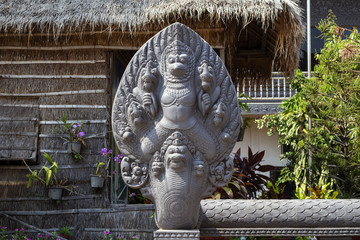 Preah Promaeath pagoda in Siem Reap, Cambodia. Naga stone carving decor. Buddhist temple in...