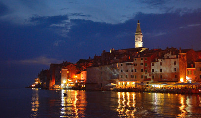 Naklejka na ściany i meble Old town of Rovinj Croatia at night with lights and reflections