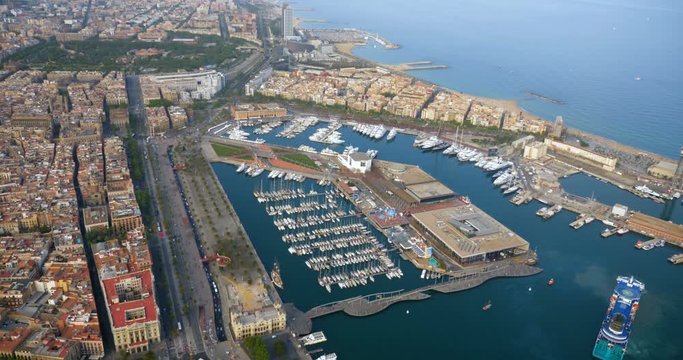 Aerial view of Barcelona Port, marina with boats and seafront Mirador Monument, Spain