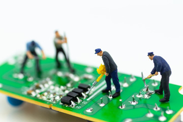 Miniature worker repairing mainboard, clear virus computer and repair, security and technology concept.