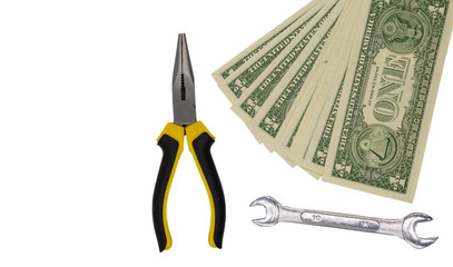 Dollar bills and repairing tools isolated