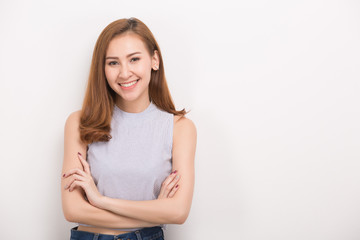 Fototapeta premium Smiling woman with crossed arms. Portrait isolated on white background.