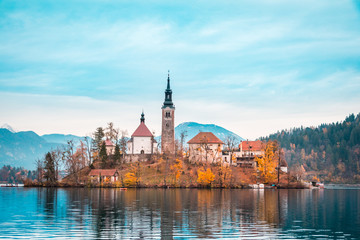 Fototapeta na wymiar View of Bled Lake during Autumn with Bled Castle and snow and mountains in background, Bled Lake, Slovenia