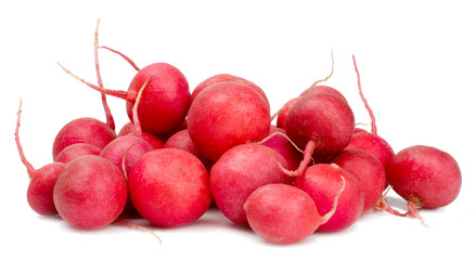 Radishes in a heap isolated on white.