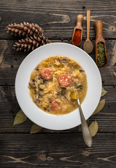 Slovak christmas cabbage soup with mushrooms on natural background.