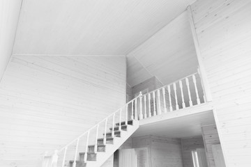 Fototapeta premium Stairway goes up, empty new wooden house