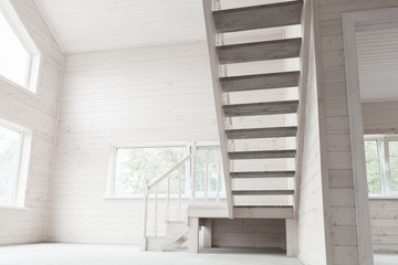 Empty new wooden house interior, stairway