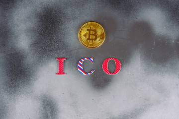 ICO initial coin offering. Modern silver foil mystic background with a bitcoins  and ICO letters....