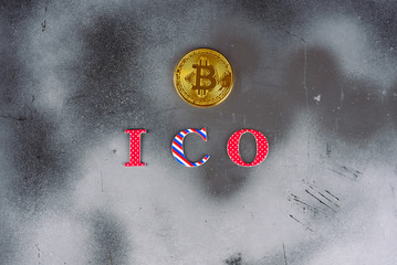 ICO initial coin offering. Modern silver foil scratched background with a bitcoin  and ICO word. In...