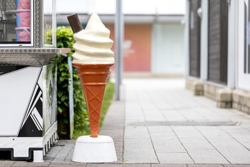 Vintage plastic promotional ice cream cone with vanilla whipped ice cream and a chocolate flake...