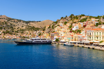 Fototapeta na wymiar View of Gialos Harbor and beautiful island of Symi. Greece