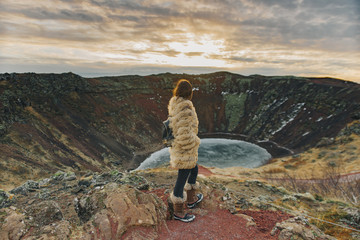 Young woman with fur coat in Kerid crater in wintertime © Susana Perez
