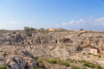 Fototapeta na wymiar Mosta, Malta. Fortification of the Victoria Line in the rocks (XIX century)