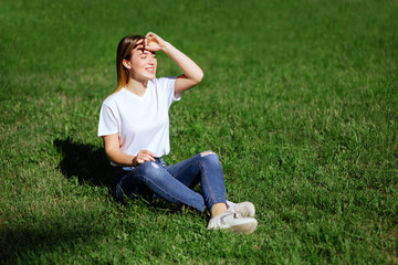 pretty young woman in a park.