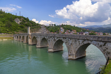 Fototapeta na wymiar Old Stone Bridge on the Drina river in Visegrad
