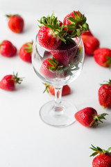 scattered strawberries on a white background