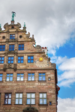 Old historic Fembohaus. Sun clock on the wall. Nuremberg, Germany