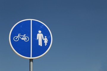 Blue road sign for bicycle and pedestrian