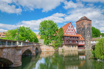 German architecture and Pegnitz river. Old fachwerk house. Nuremberg, Bavaria, Germany. Reflected...