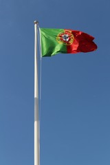 Portugal flag waving under blue sky