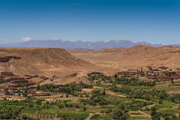 The beautiful valley of Ait Benhaddou with the Atlas mountains in the background
