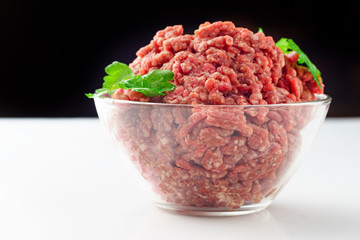 Raw minced meat in a glass plate