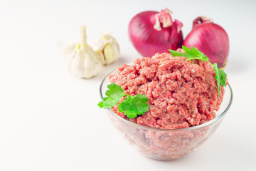 Raw minced pork in a plate onwhite  close-up