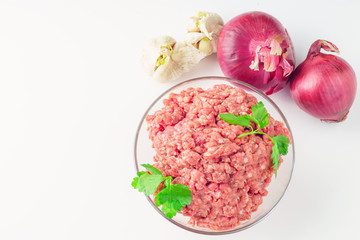 Raw minced meat in a plate on white background