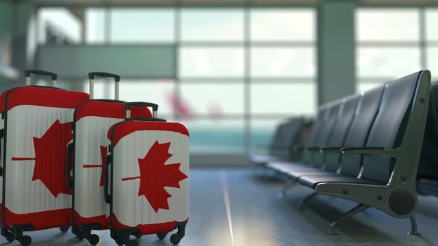 Travel suitcases featuring flag of Canada. Canadian tourism conceptual animation