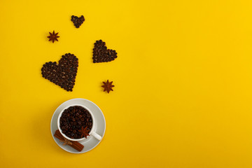 Cup of coffee seeds cinnamon anis coffee hearts