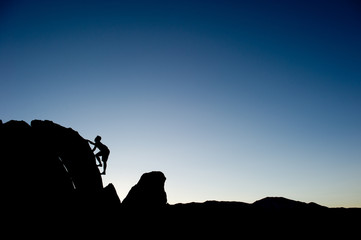 Climber silhouetted on ridge