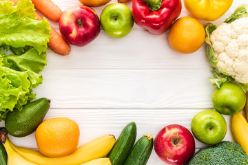 top view of fresh fruits and vegetables with copy space on wooden table
